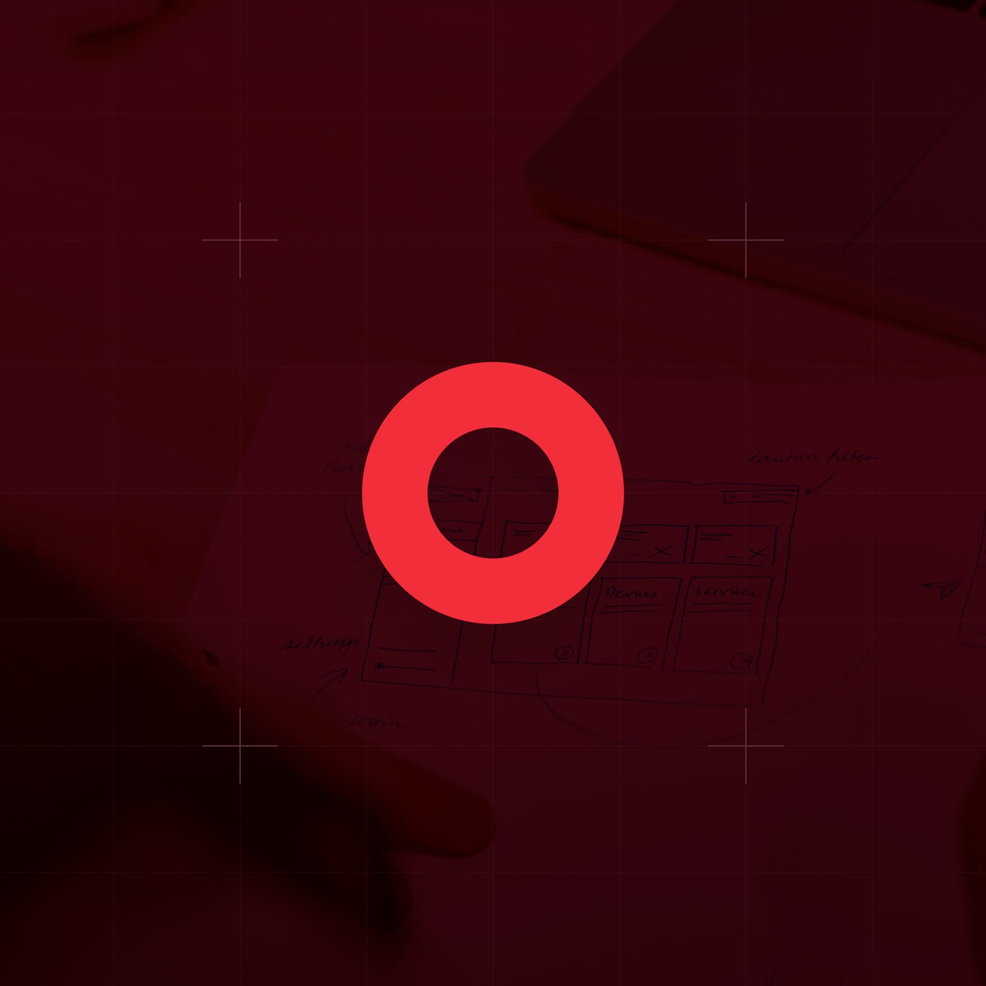 CodeFish Studio ring glyph over a red-tinted photo of hand-drawn interface sketches